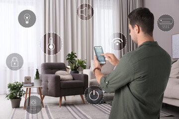 Canvas Print - Man using smart home control system via application on mobile phone indoors. Different icons around him