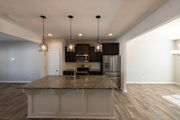 Kitchen with stainless steel appliances and granite counter tops. Investment, renting, or house ownership concept.