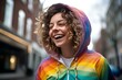 woman is in a rainbow hoodie moving and smile, movement and spontaneity, london street background. generative AI