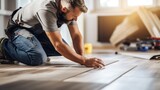 Fototapeta  - A Construction worker installing laminate flooring, room decoration design, professional technician, laminate background.