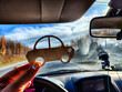 © keleny - Small wooden toy car in the hand of a woman inside a car on the background of nature with a road and a forest. The concept of choosing a transport for travel. Comfort of a trip by car