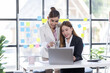 © David - Team of confident asian business women point to graphs and charts to analyze market data, balance sheet, account, net profit to plan new sales strategies to increase production capacity.