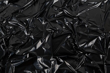 Full Frame Abstract Background Of Crumpled Black Plastic Film Bag