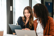 © makibestphoto - Two professional caucasian with african american businesswoman friends collaboration, working together at office, using laptop, Generally accepted audit standards, Earnings before interest and taxes