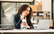 © makibestphoto - African American businesswoman, focused on her work on a laptop, possibly managing industrial production tasks.