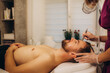 © Roman - A cosmetologist is making the procedure Microdermabrasion of the facial skin in a beauty salon. Cosmetology for men and professional skin care.