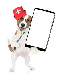 Poster - Funny jack russell terrier wearing like a doctor with stethoscope on his neck showing big smartphone with white blank screen in it paw. isolated on white background