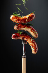 Wall Mural - Grilled Bavarian sausages with rosemary.