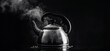 Tea kettle with boiling water on a black background