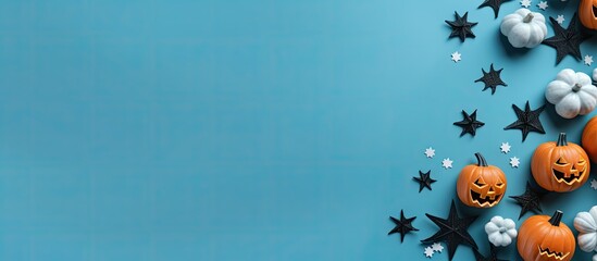 Wall Mural - halloween concept with holiday decorations bats ghosts spiders and pumpkins on blue background party