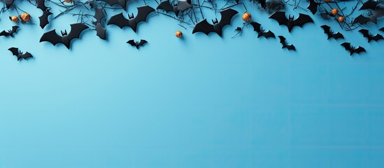 Wall Mural - halloween concept with holiday decorations bats ghosts spiders and pumpkins on blue background party