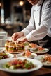 © Jorge Ferreiro - chef in a restaurant preparing a delicious meal