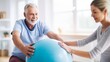 Senior man having rehabilitation at physiotherapist medicine room with physio ball