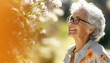 Elderly lady near a flowering tree ,spring concept