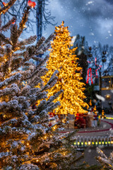 Wall Mural - Christmas in Copenhagen, Tivoli Gardens, with a decorated tree, snowfall and bokeh lights, Denmark