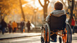 Rear view of disabled child in wheelchair, outdoors, beautiful sunlight