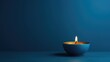 Zen Candle with smooth blue background. A single candle with copyspace.