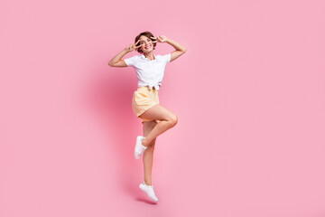 Poster - Full length photo of jumping trampoline funky active lady wearing spring season apparel cover eyes v sign isolated on pink color background