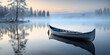 The canoe lies still on the lake glassy surface, cradled by the fog ethereal caress