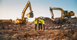 © Gorodenkoff - Construction Site With Excavators on Sunny Day: Diverse Team Of Male And Female Real Estate Developers Discussing Project. Engineer, Architect, Inspector Talking About Apartment Building, Using Tablet