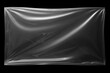 © Iryna - Transparent plastic wrap overlay on black background. Horizontal stretched polyethylene cover.