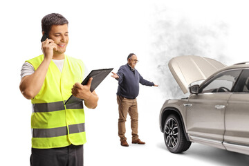 Canvas Print - Road help worker on the phone and a man with a car breakdown