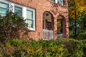 Wall Mural - Old brick house facade with arched entrance, Brighton, Massachusetts, USA