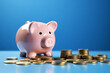 piggy bank with coins isolated on light blue background. 