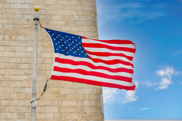 Wall Mural - US flag near Washington Monument in Washington DC