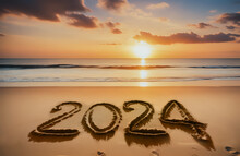 New Year 2024 Concept. Text 2024 Written On Sandy Beach During Sunset. New Year Start. Copy Space.