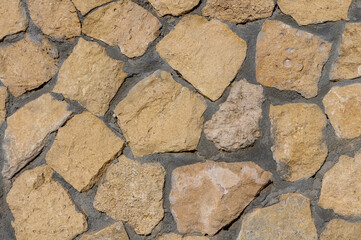 Wall Mural - fence made of real stone as a background 3