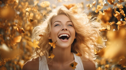 Poster - happy young blond woman with yellow flowers in autumn