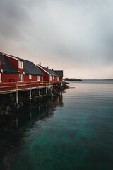 Wall Mural - a house is situated on the ocean shore to let you know how far away it, Norway