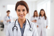 © LunaKate - Young female doctor on modern clinic background.