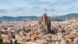 Aerial drone view of Sagrada Familia in city downtown. Famous residential districts around, greenery, Barcelona, Spain