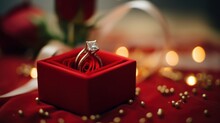 A Sparkling Diamond Ring Elegantly Placed On A Vibrant Red Box.