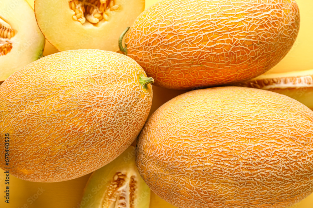 Sweet melons on yellow background