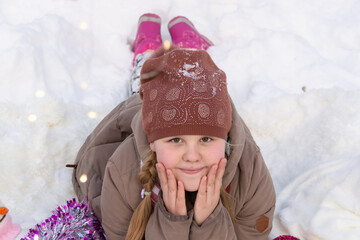  A beautiful girl in a snowy winter forest.