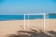 © Hanoi Photography - Soccer goal post on the beach with sand and blue sky