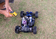 a man's hand Starting the engine, radio control race car, (RC toys)