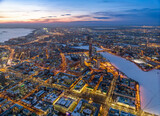 Fototapeta Miasto - Embankment of the central pond and Plotinka in Yekaterinburg at winter sunset. The historic center of the city of Yekaterinburg, Russia, Aerial View