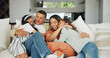 © Azeemud/peopleimages.com - Love, hug and happy family on a sofa with support, care and security in their home together. Smile, embrace and girl children with parents in a living room for bond, playing and having fun in a house