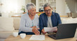 © Azeemud/peopleimages.com - Elderly, couple and documents for financial planning in home with laptop, internet and reading for account balance. Senior man, woman and discussion with tech, webpage or online banking for budget