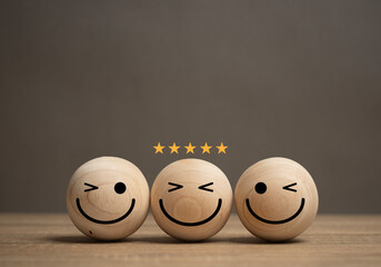 concept of service satisfaction A smiley face ball is placed on the table and there is a gold star on the ball. The customer feedback survey rating. Business excellent score. Good evaluation emotion.