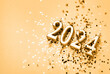 New Year 2024 celebration festive background with copy space made with golden candles in the form of number two thousand twenty four and sparkles.