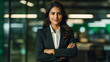 Young confident smiling Indian business woman leader, successful entrepreneur, professional company executive ceo manager, wearing suit standing in office with arms crossed. made with generative ai