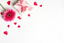 Gift Box, Flower And Red Heart Confetti On Light Abstract Texture Background