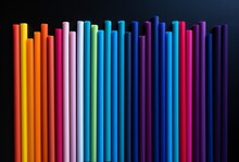 rainbow colored paper straws on a black surface minimalist school colors minimalistic drawings