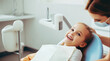 Little cute girl sitting in dental chair while doctor fixing her teeth. Dental care concept.