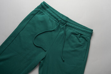 Sticker - Green sweatpants on a white background